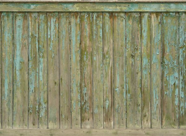 Weathered planks set vertically with fading light blue paint.